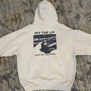 Brandy Melville Cream Pullover Hoodie with Urban Graphic